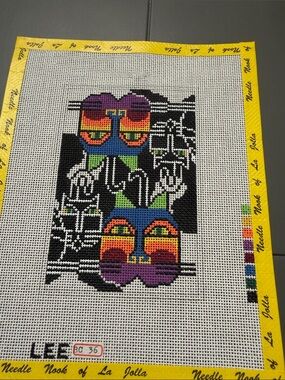 needlepoint canvas features a stylized cat byBJ for Lee Needle Arts.🐈‍⬛